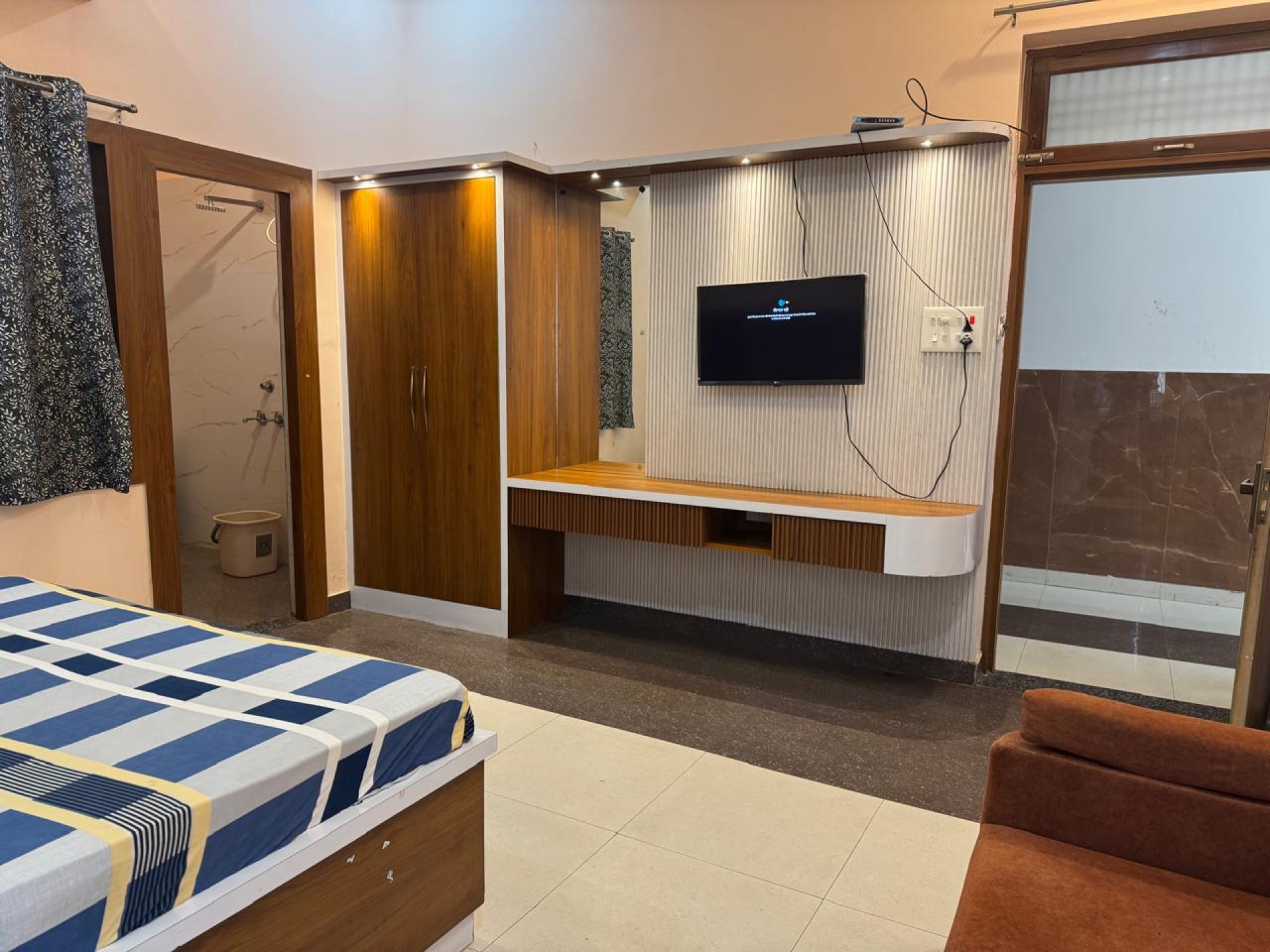 Room with smart TV and sofa